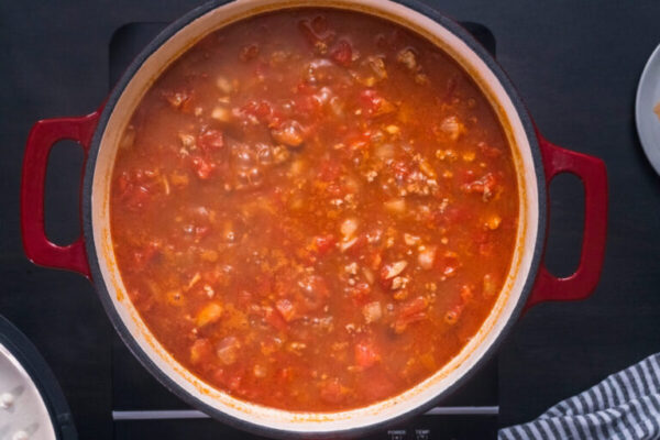 Cooking turkey chili in cast iron dutch oven.