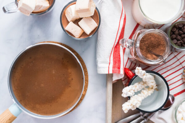 Flat lay. Hot chocolate bar with variety of topping on the tray .