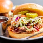 BBQ pulled pork sandwich with coleslaw on brioche buns.