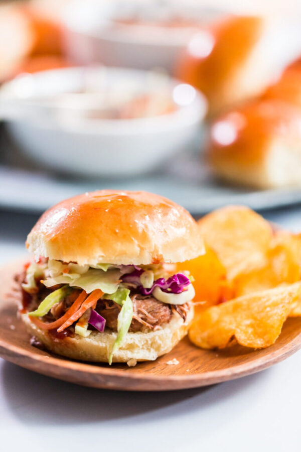 BBQ pulled pork sandwich in shape of small sliders with brioche buns.