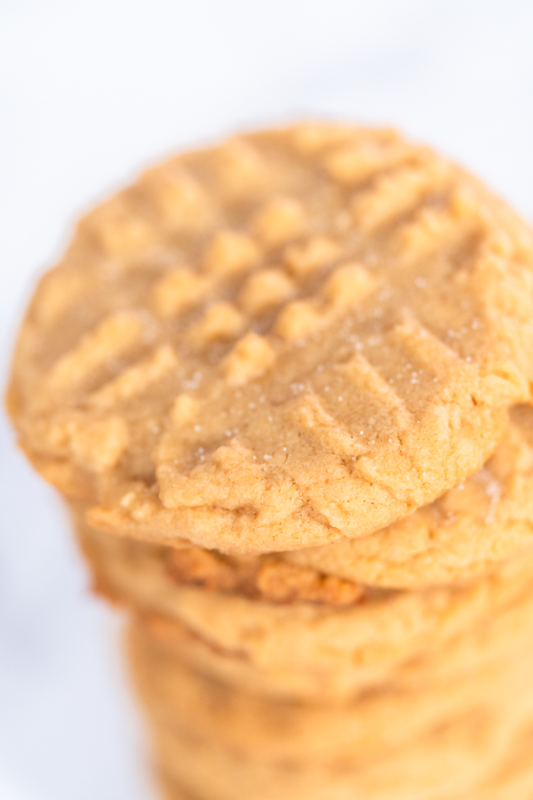 Stack of peanut butter cookies on white surface for serving or gifting
