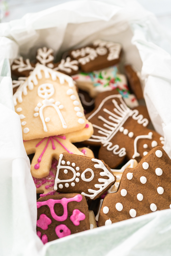 Wrapping homemade gingerbread and sugar Christmas cookies for presents.