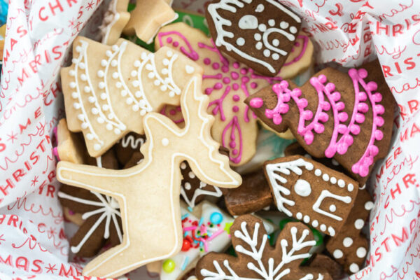 Wrapping homemade gingerbread and sugar Christmas cookies for presents.