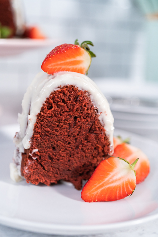Close-up of red velvet bundt cake slice with strawberries