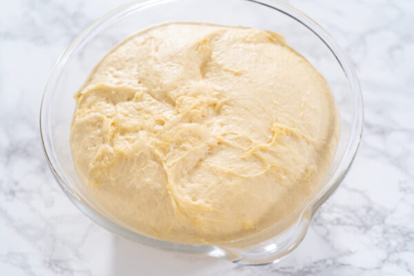 Preparing bread dough to bake homemade brioche buns.