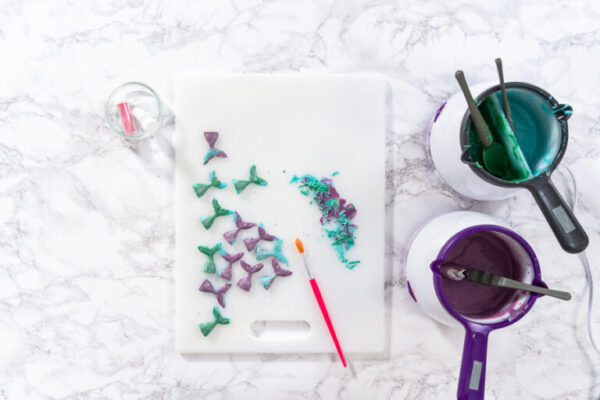 Chocolate mermaid tails - Arina Photography Flat lay. Homemade chocolate mermaid tails covered with glitter dust.