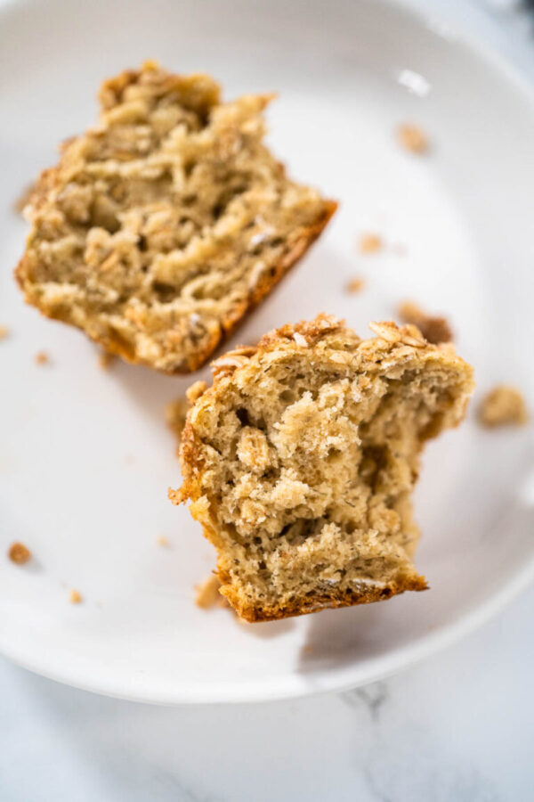 Freshly baked banana oatmeal muffins with oatmeal sugar topping.