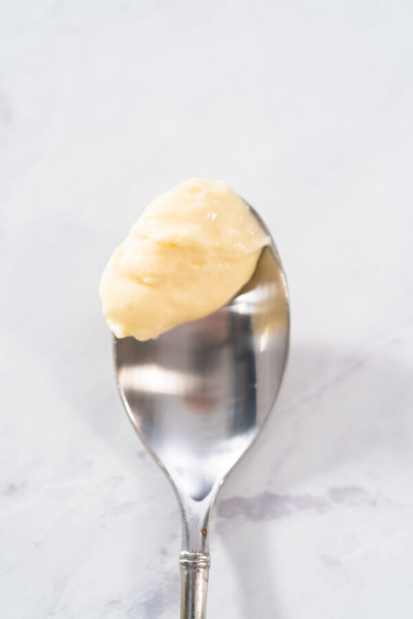 Cream cheese filling for bundt cake in small glass jat.