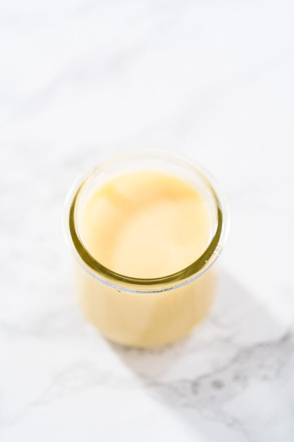 White chocolate ganache - Arina Photography White chocolate ganache in a small glass mason jar.