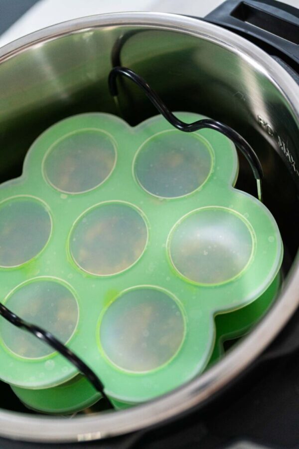 Cooking egg bites in silicone inserts in a pressure cooker.