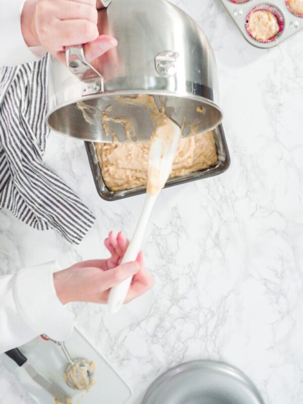 Flat lay. Step by step. Pouring banana bread batter into a loaf pan to bake banana bread.