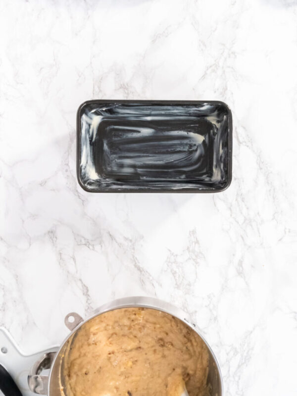 Flat lay. Banana nut bread batter in a metal mixing bowl.